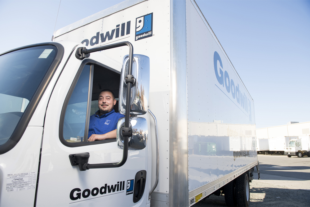 man driving a Goodwill trailer